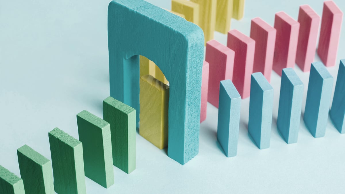 colored dominoes consolidating under an arch