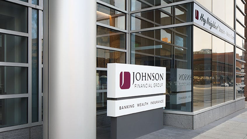 exterior view of cathedral place location displaying the johnson financial group sign.