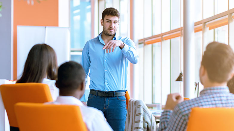 man giving presentation to employees in meeting